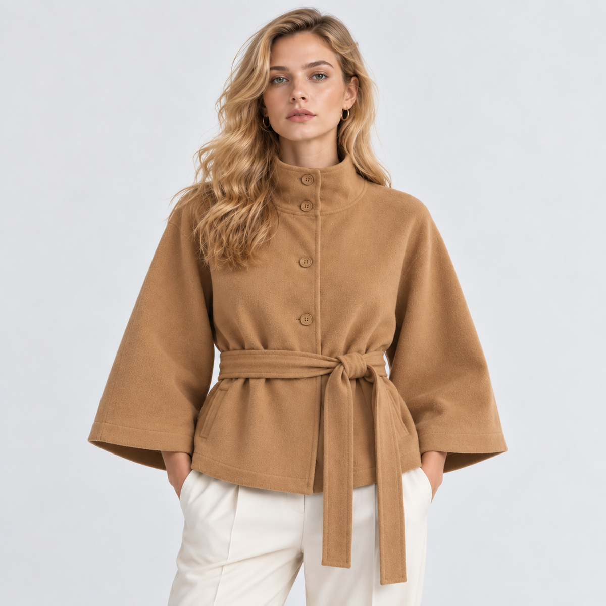 Women's camel brown cape coat with wide three-quarter sleeves, button closure, and matching waist belt