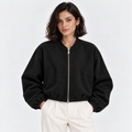 Women's black zip-up bomber jacket with ribbed cuffs, collar, and hem