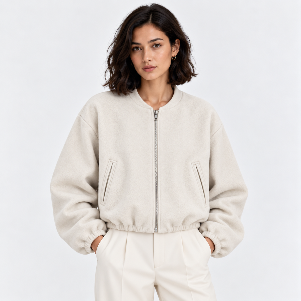 Women's cream zip-up bomber jacket with ribbed cuffs, collar, and hem