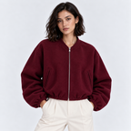 Women's burgundy zip-up bomber jacket with ribbed cuffs and hem