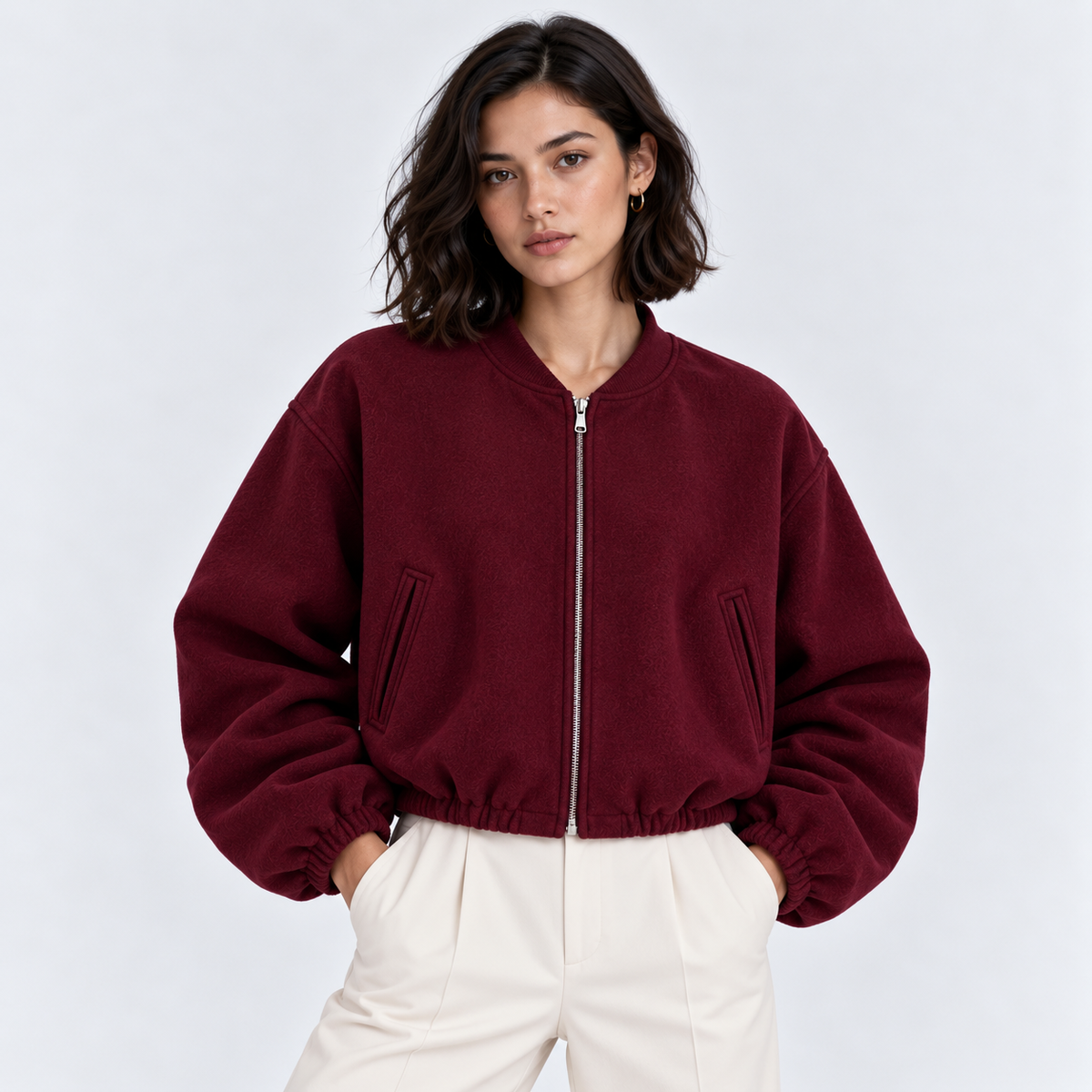 Women's burgundy zip-up bomber jacket with ribbed cuffs and hem