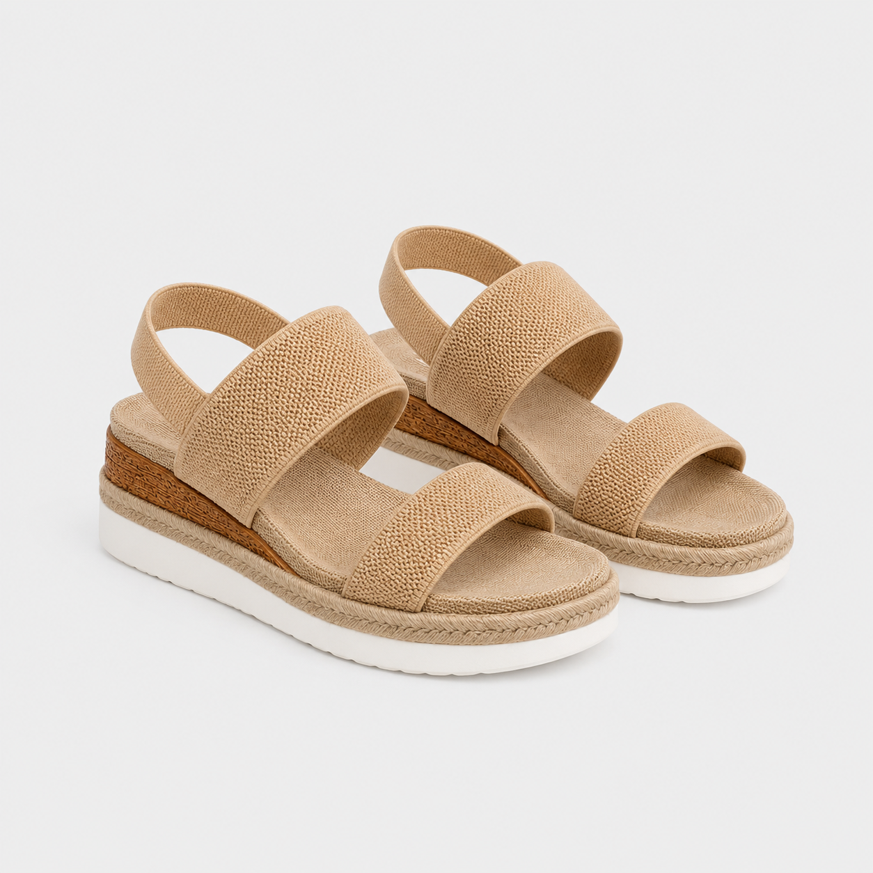 A pair of women's open-toe platform sandals in a natural beige woven fabric, featuring a cork-wrapped wedge midsole and a white outsole, shown on a light gray background.