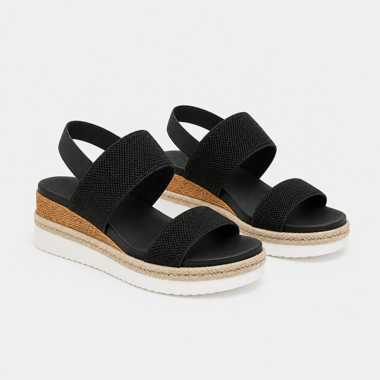 A pair of women's black woven-look wedge sandals with espadrille-style jute-wrapped midsoles and white soles, shown on a light gray background.