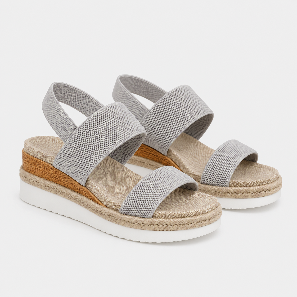 A pair of women's wedge sandals in light gray mesh fabric with a natural jute-wrapped wedge heel and a white outsole, shown against a light gray background.