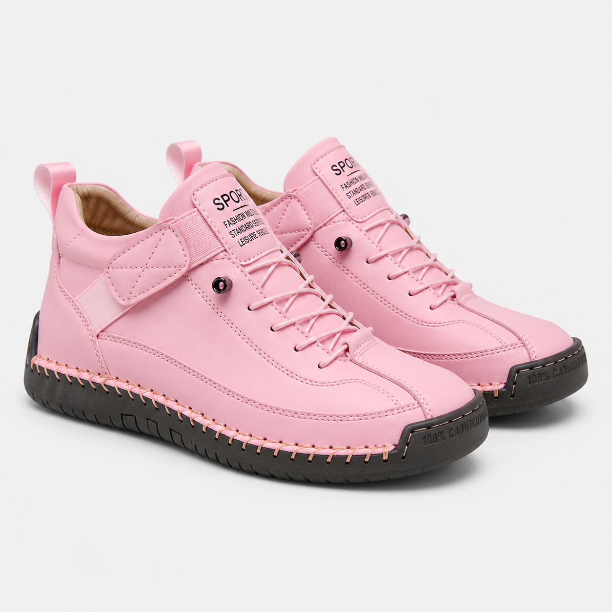 A pair of pink high-top sneakers with black soles and matching pink laces, displayed on a light gray background.