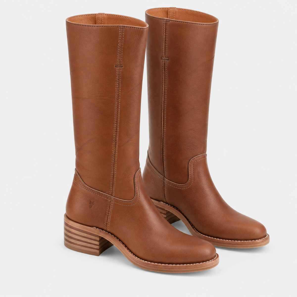 A pair of tall brown leather boots with stacked block heels, shown from the side against a light gray background.