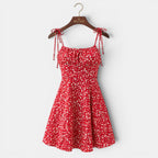 Red floral dress on a hanger with 'BELCION' branding against a white background