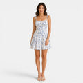 Woman wearing a floral dress on a white background