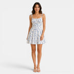 Woman wearing a floral dress on a white background