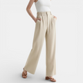 Beige wide-leg pants worn by a person on a white background