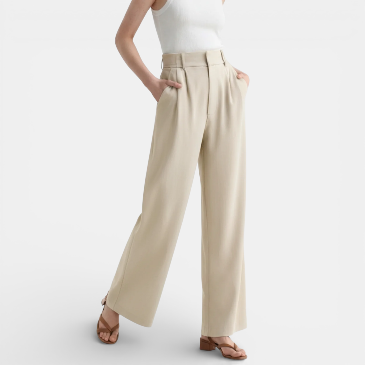 Beige wide-leg pants worn by a person on a white background