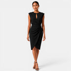 Woman wearing a black dress on a white background