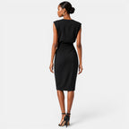 Woman wearing a black dress on a white background