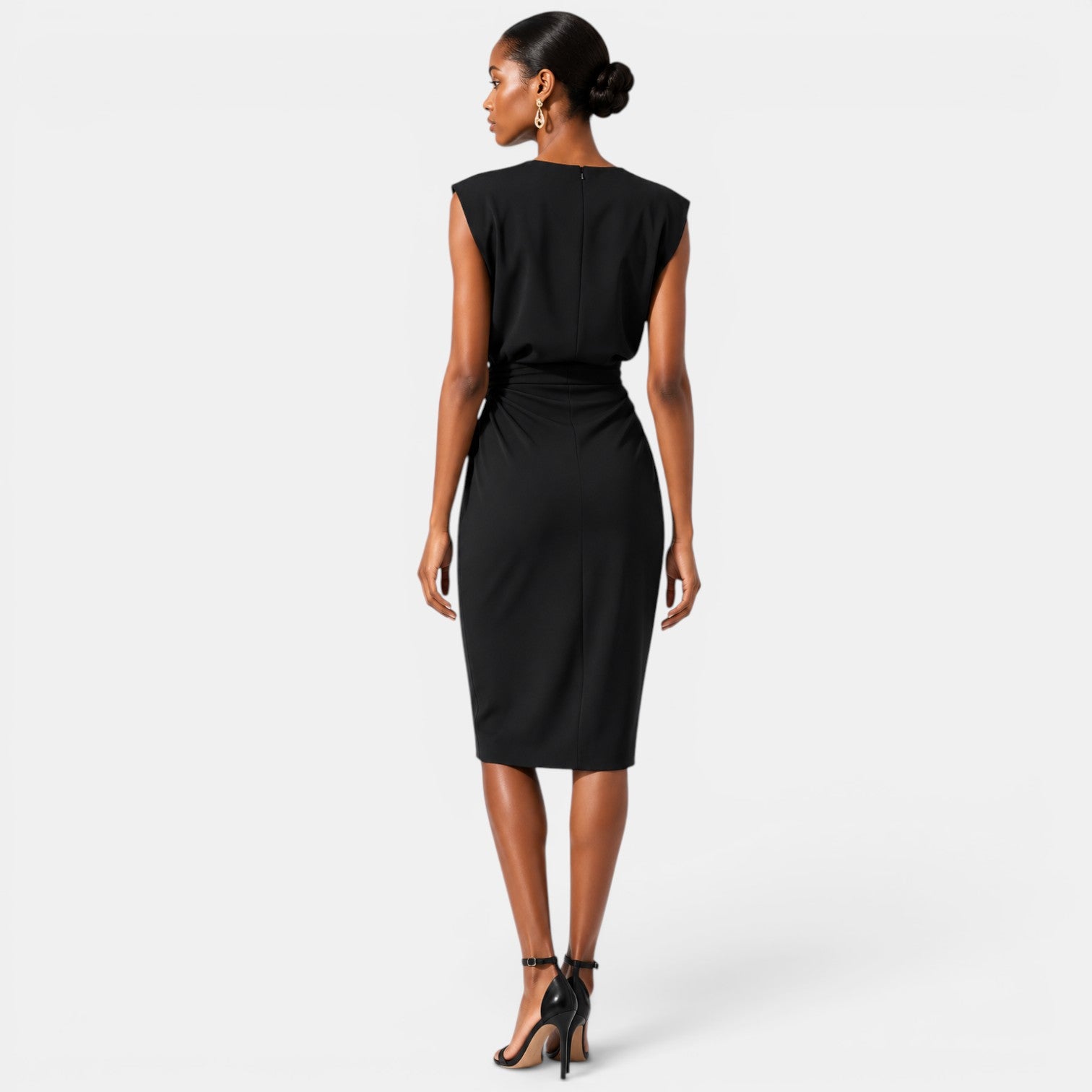 Woman wearing a black dress on a white background