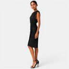 Woman wearing a black dress on a white background