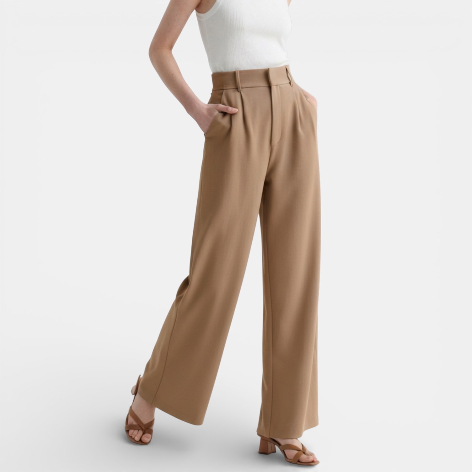 Tan wide-leg pants worn by a person on a light gray background