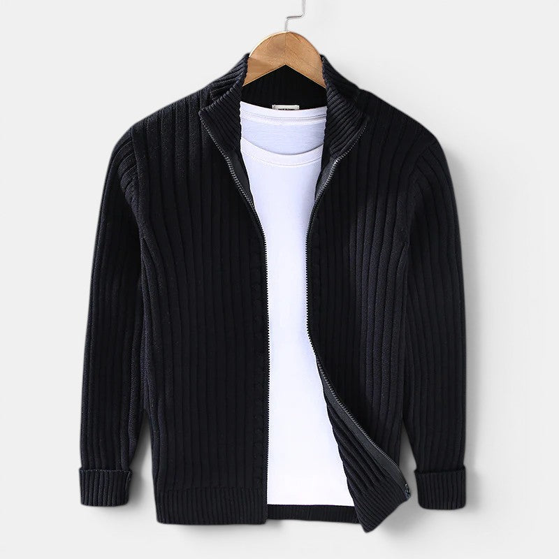 Black ribbed knit cardigan on a hanger against a white background