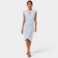Woman wearing a light blue dress on a white background