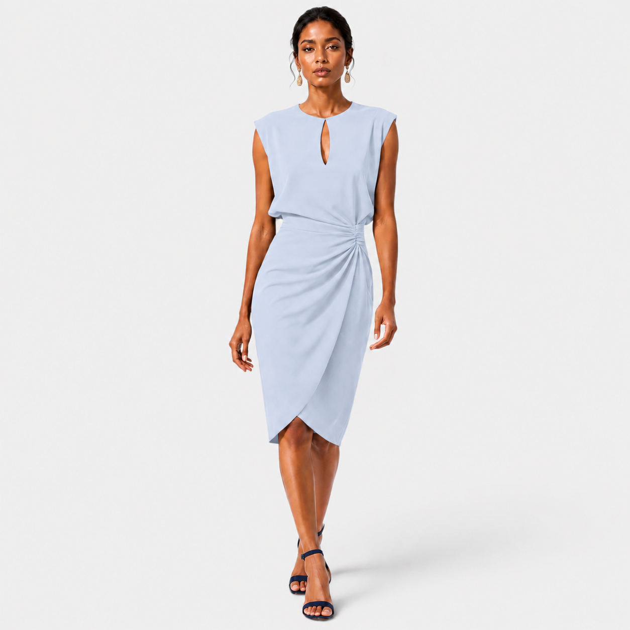 Woman wearing a light blue dress on a white background