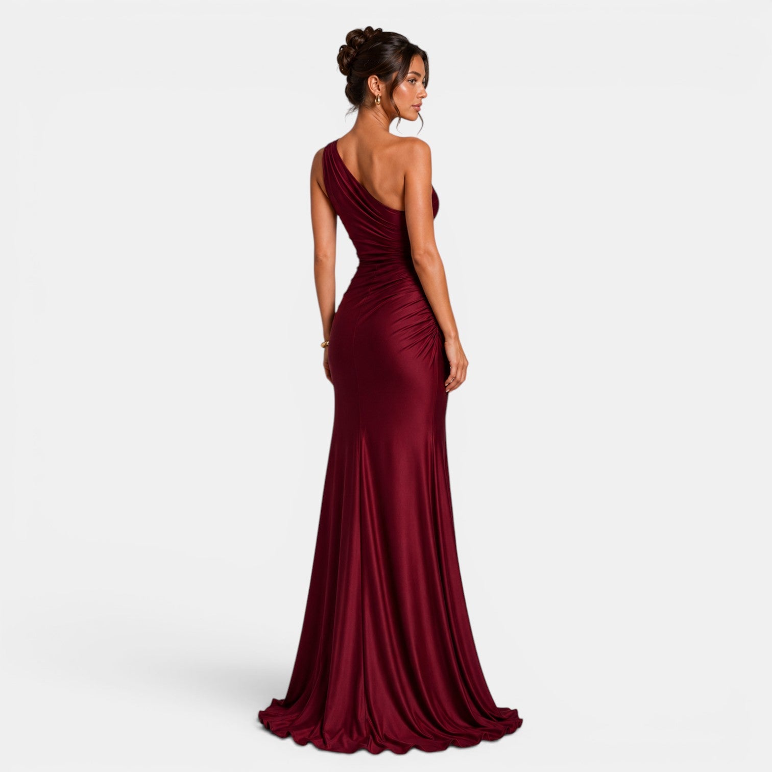 Woman wearing a burgundy evening gown on a white background