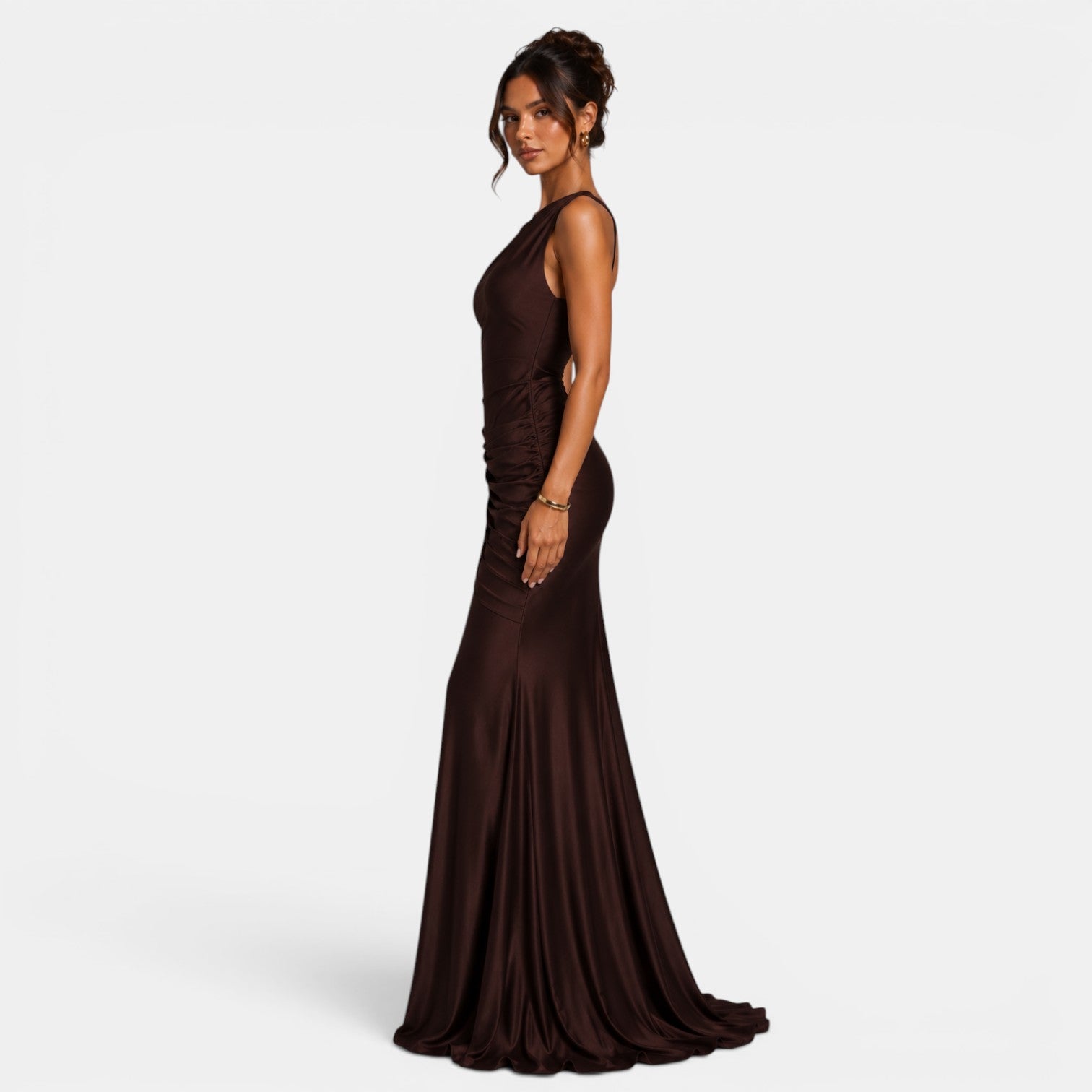 Woman wearing a brown evening gown on a white background