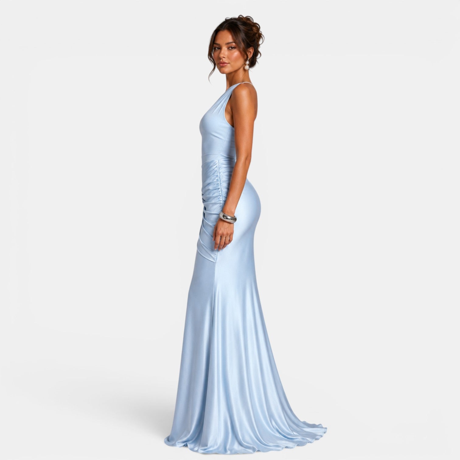 Woman wearing a light blue evening gown on a white background