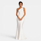Woman wearing a white one-shoulder gown on a white background