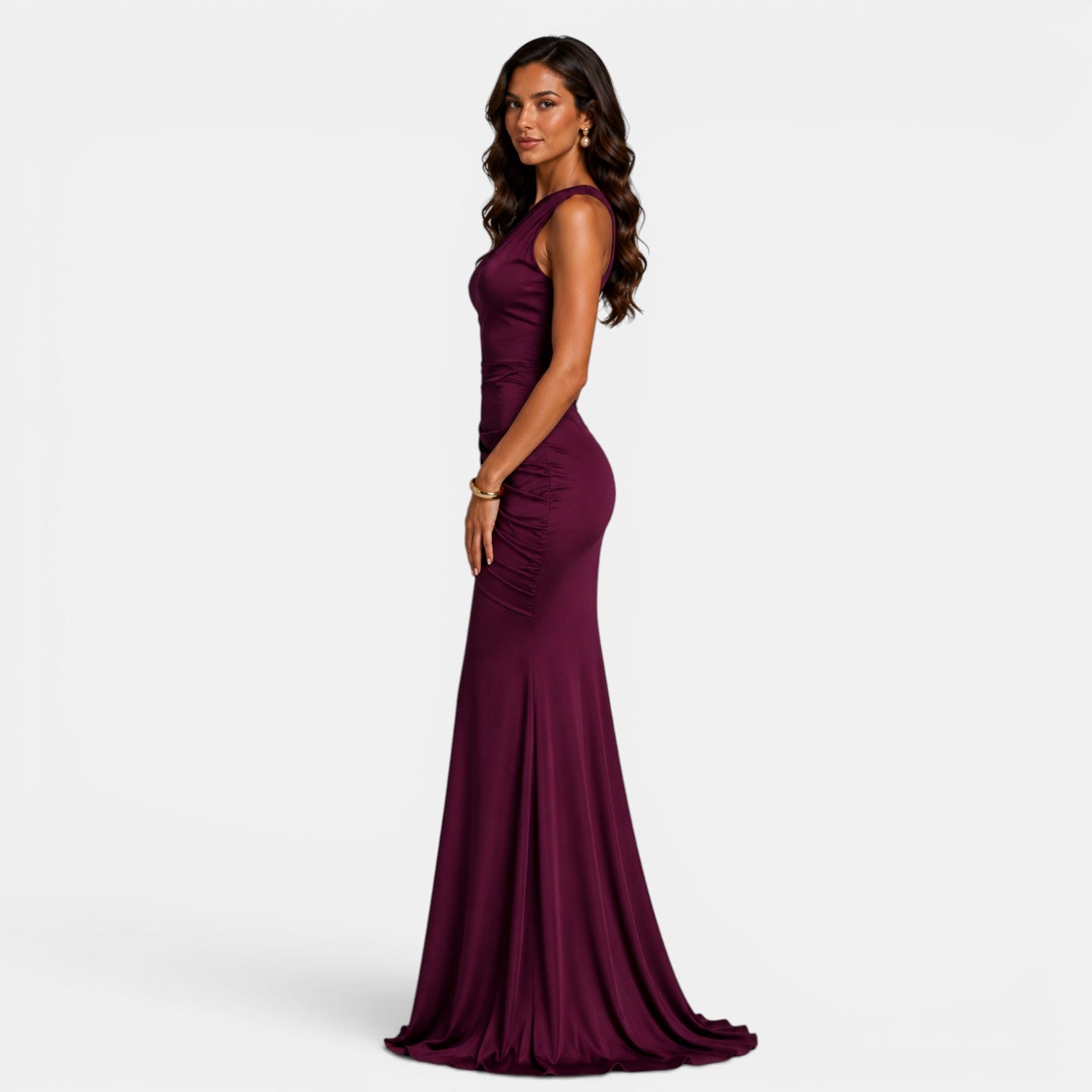 Woman wearing a burgundy evening gown on a white background