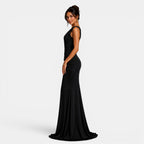 Woman wearing a black evening gown on a white background