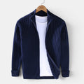 Navy blue ribbed sweater on a hanger against a white background