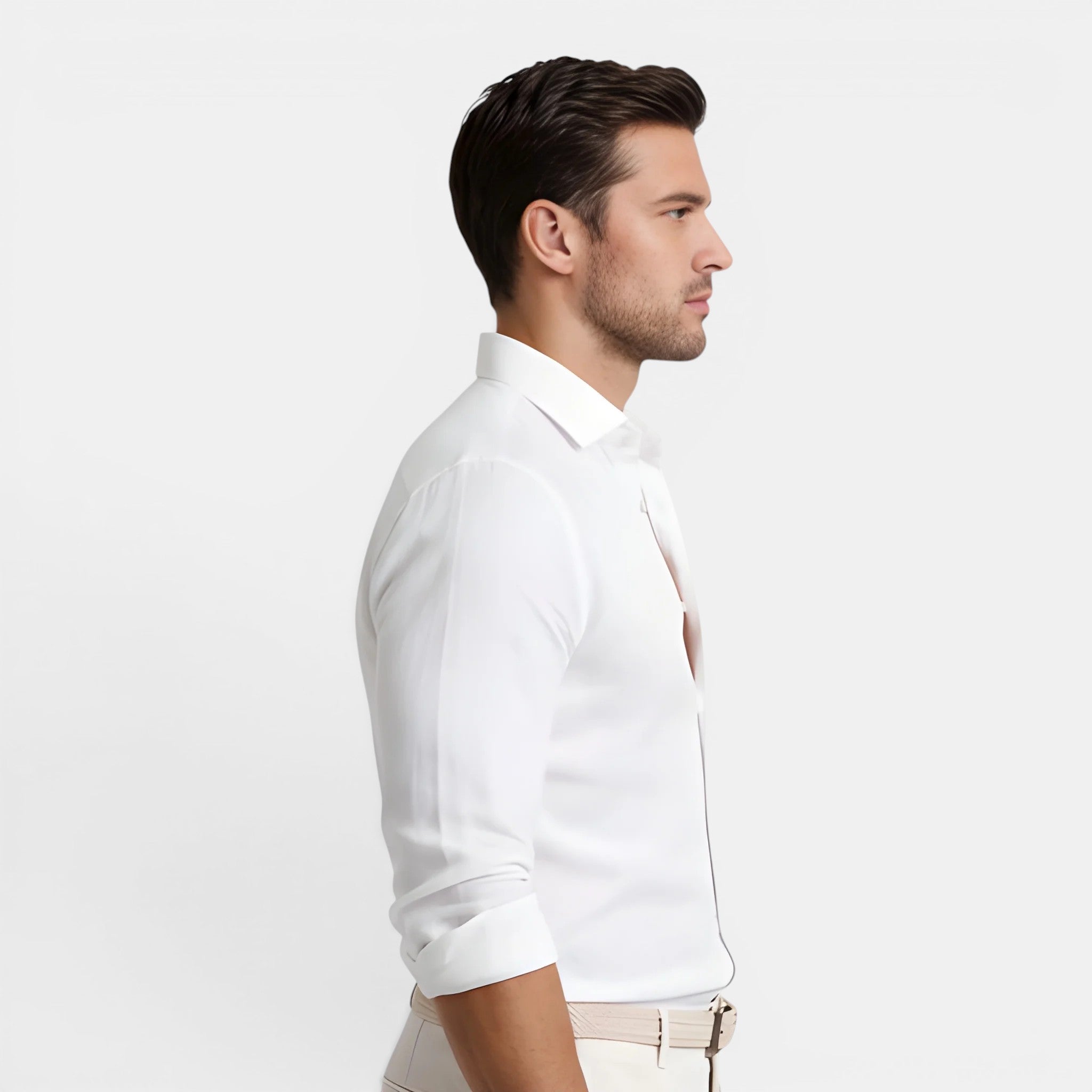 Man wearing a white dress shirt on a light gray background