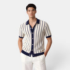 Man wearing a striped shirt with a collar on a white background
