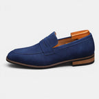 Blue loafer shoe with wooden heel on a white background