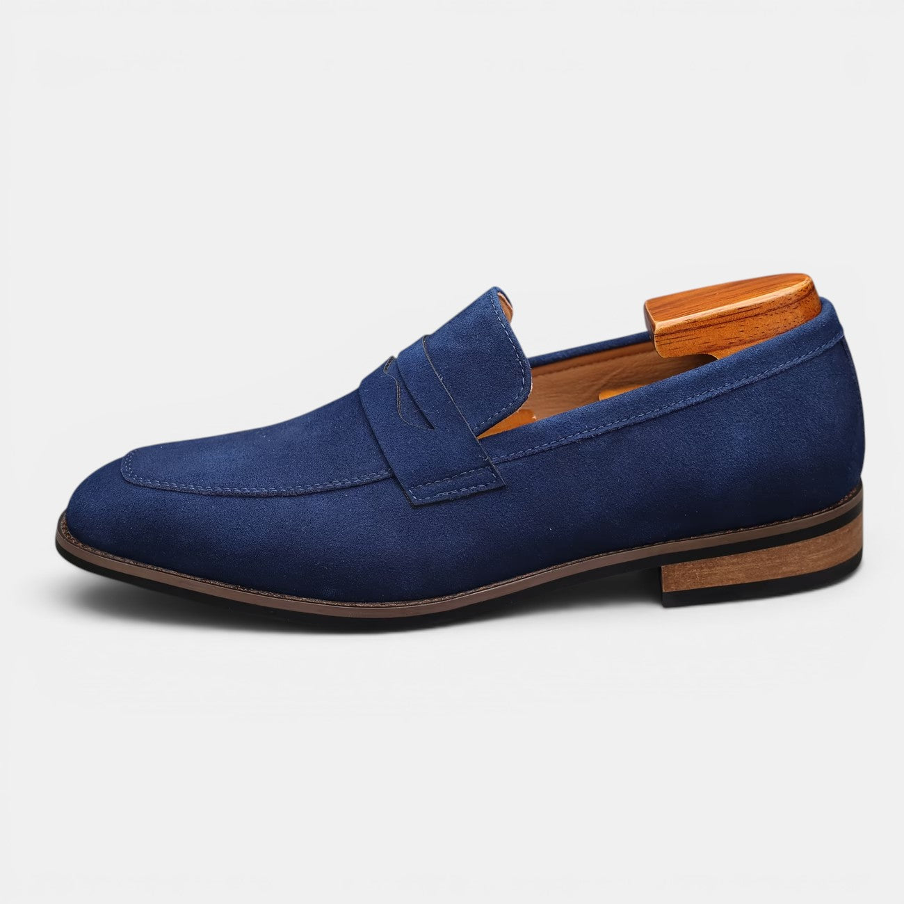 Blue loafer shoe with wooden heel on a white background