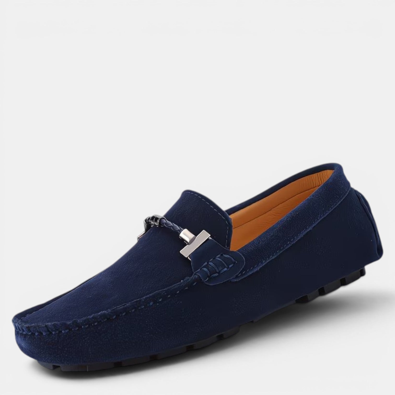 Navy blue loafer shoe on a light gray background