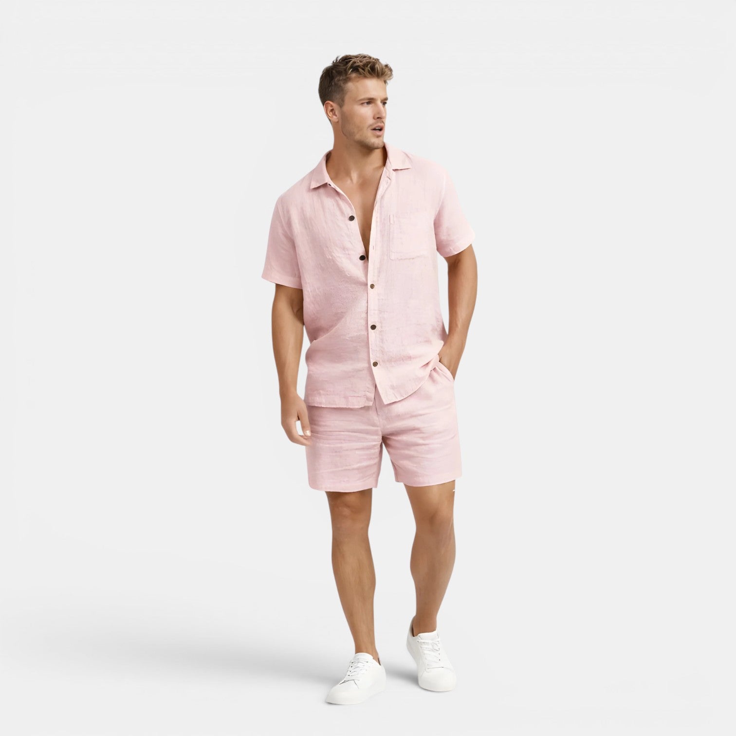 Man wearing a pink outfit with a white background