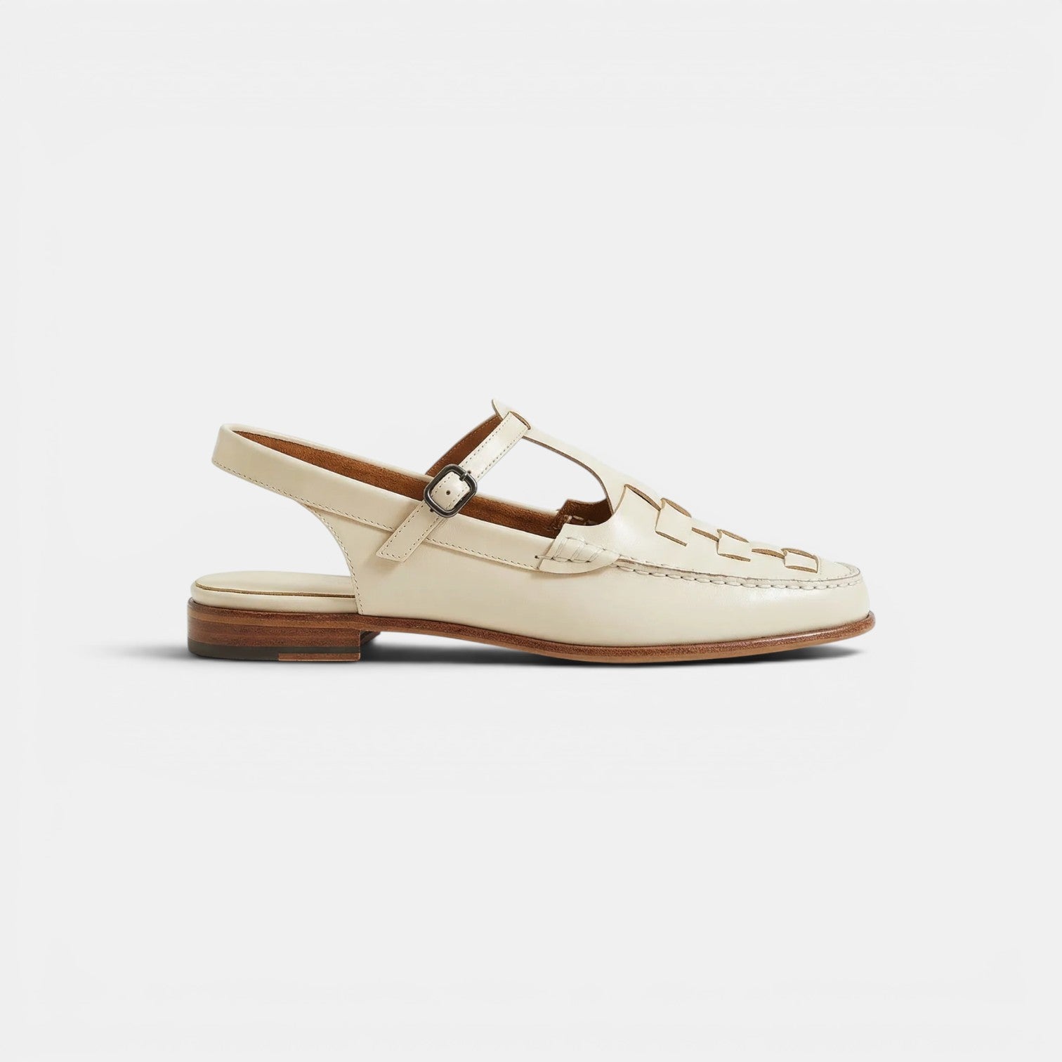 Beige sandal with brown sole on a white background