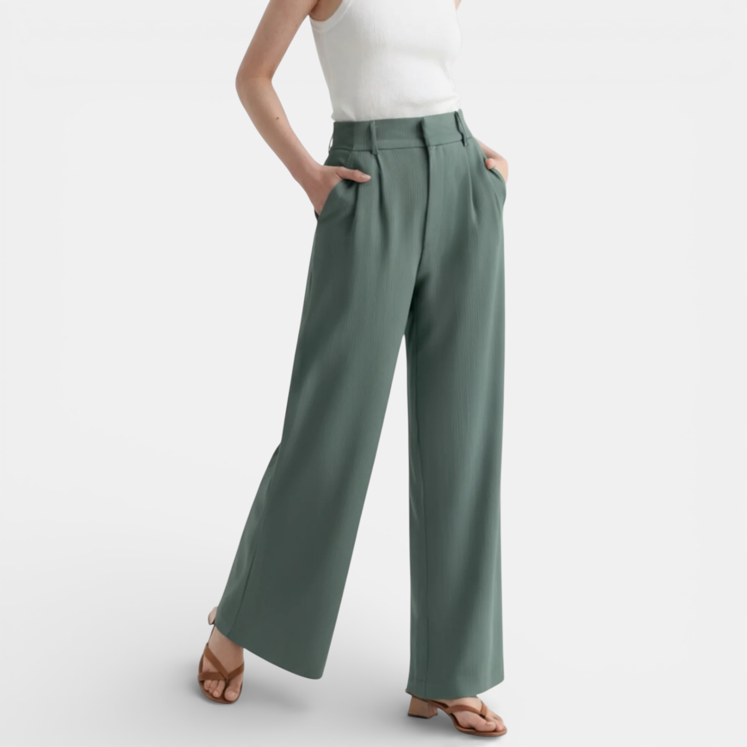 Green wide-leg pants worn by a person on a white background