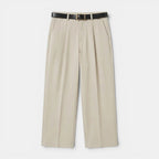 Beige pants with a black belt on a white background