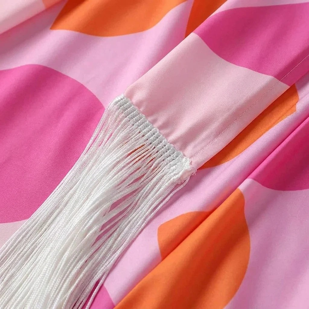 Close-up of fabric with pink and orange geometric pattern