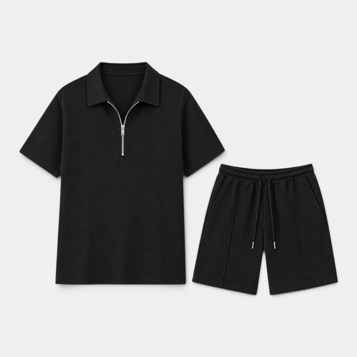 Black zip-collar polo shirt and matching drawstring shorts set displayed against a light gray background.