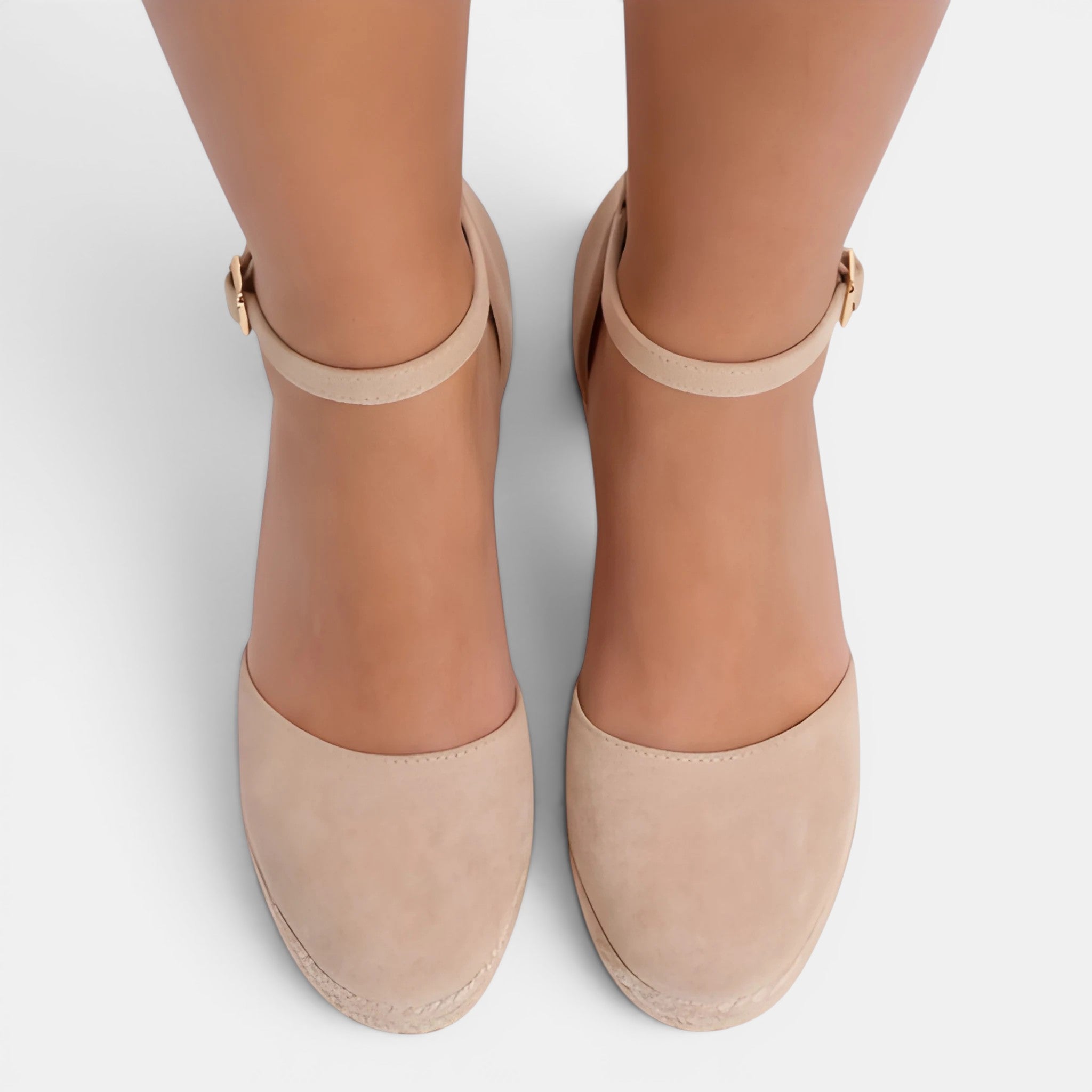 Beige high-heeled shoes with ankle straps on a white background