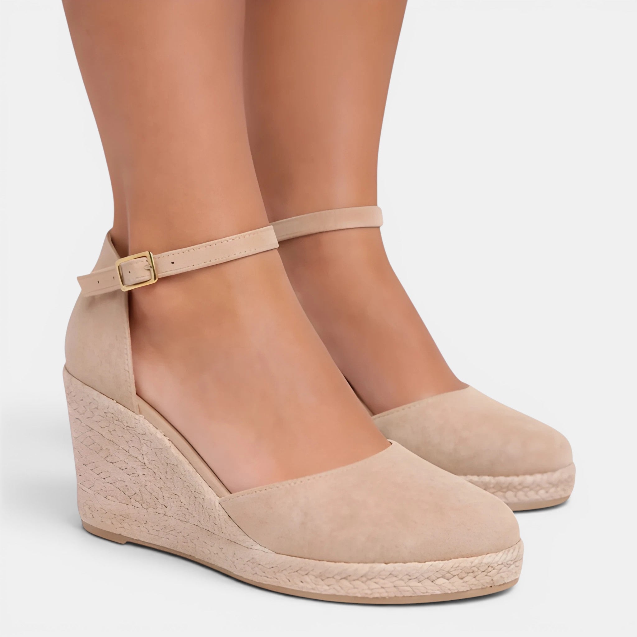 Beige wedge sandals with a strap on a white background