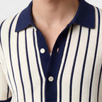 Close-up of a person wearing a navy and white striped shirt with a collar.